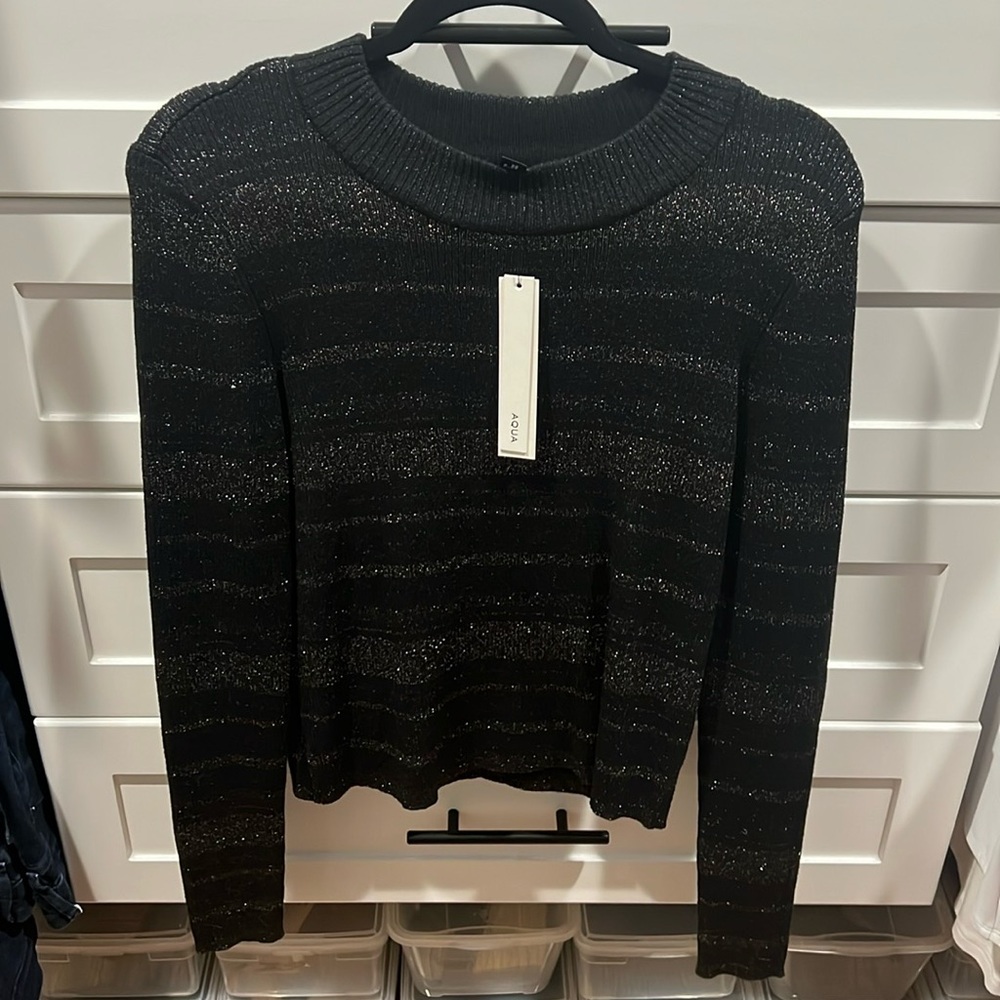 aqua new with tags!! Black and gold shimmer sweater size large.
